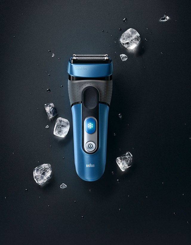 Black background with blue shaver and ice cubs around it