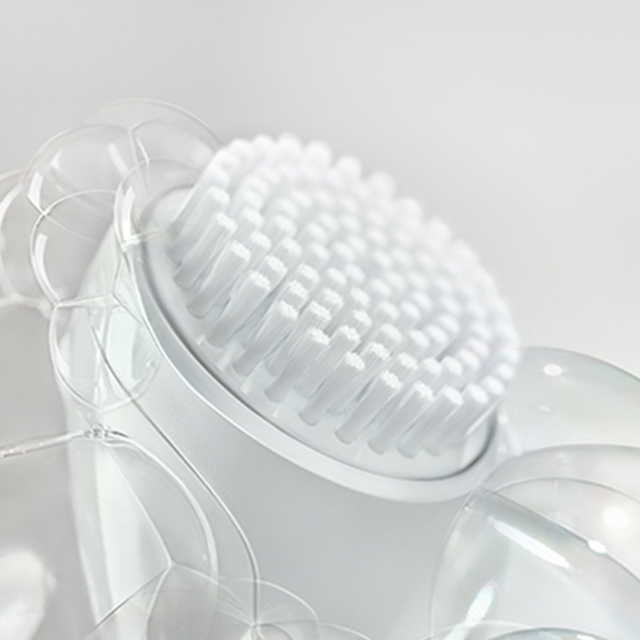 White background with bubbles surrounding white brush