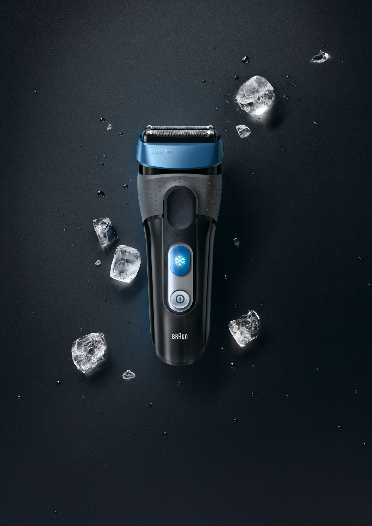 Black background with grey shaver and ice cubs around it